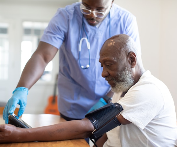 Healthcare professional consulting with a patient about medical equipment